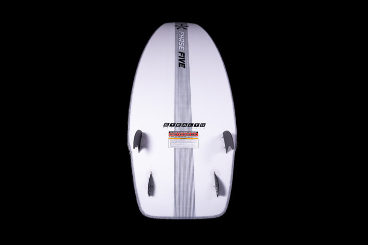 White 2025 Phase 5 Swell Stealth surfboard with black fins, center stripe, and brand logos, displayed against a black background.