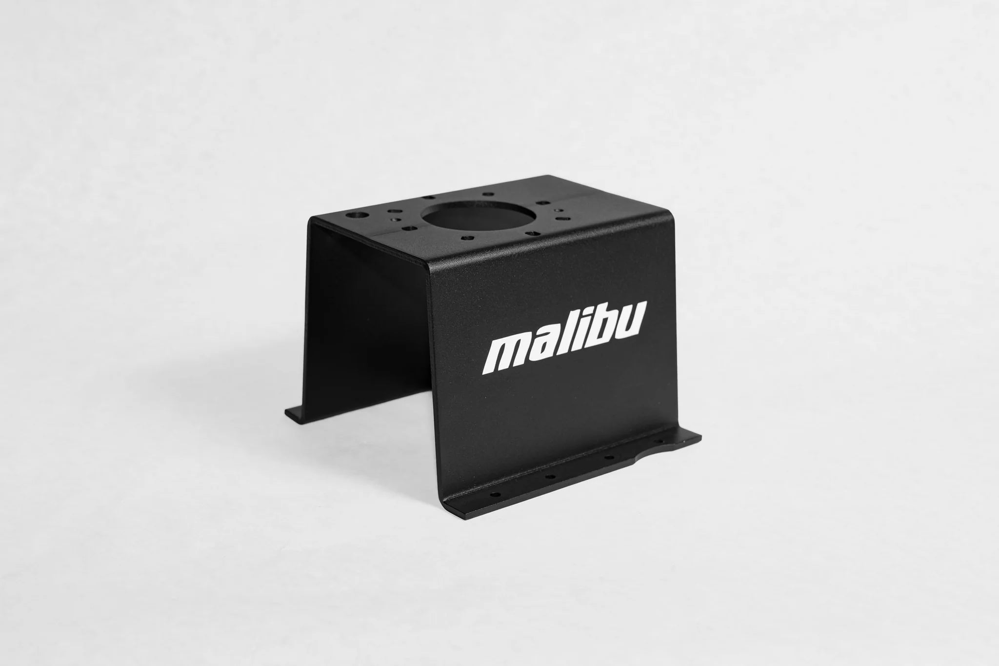 Black Malibu/Axis seat riser with white Malibu logo, designed to elevate vehicle seats for improved comfort and visibility.