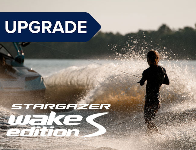 a person wakeboarding on a boat with water splashing, showcasing the Perfect Pass Stargazer Wake S Upgrade Kit with gauges.