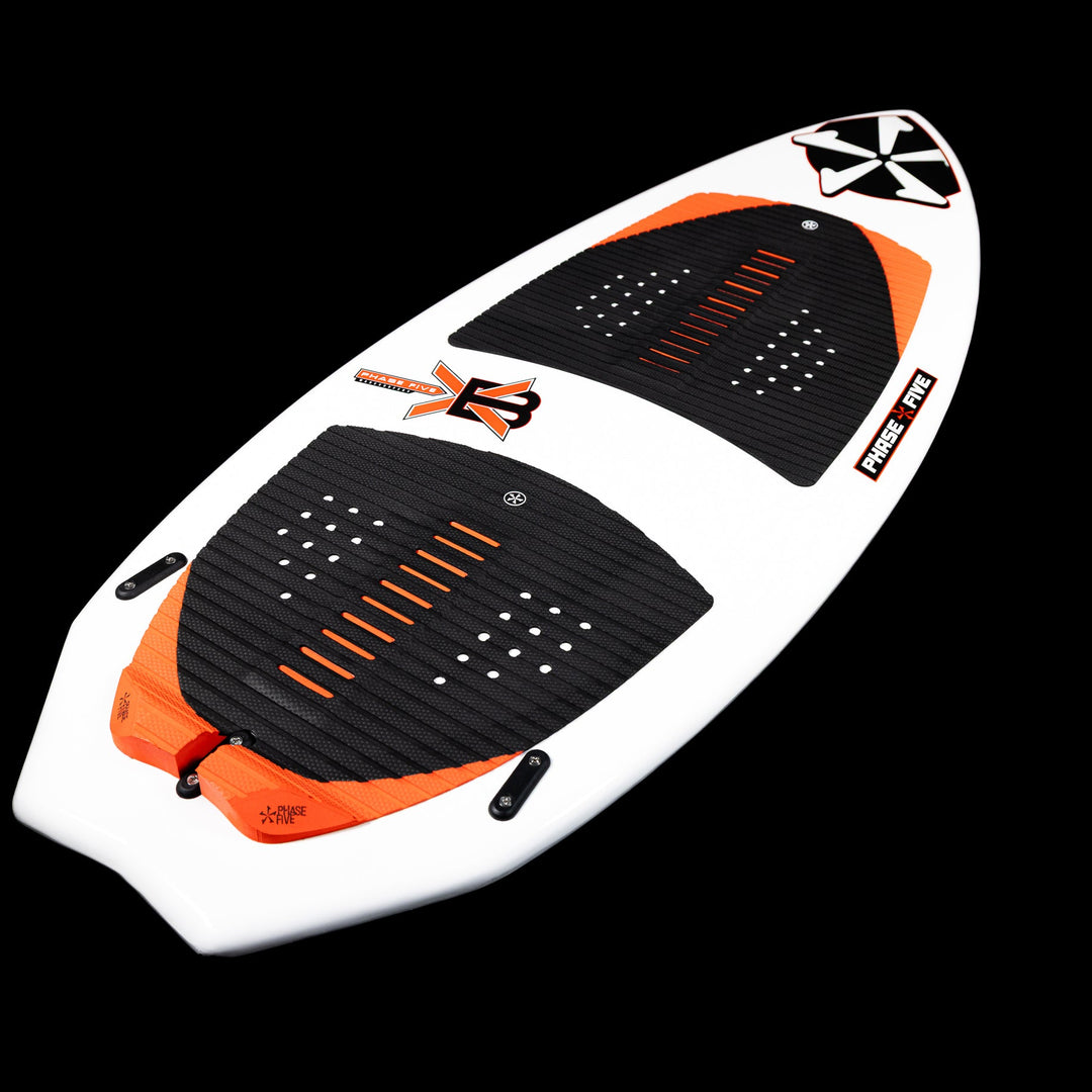 2026 Phase Five XB wake surfboard featuring a sleek design with orange accents and textured foot pads for grip.