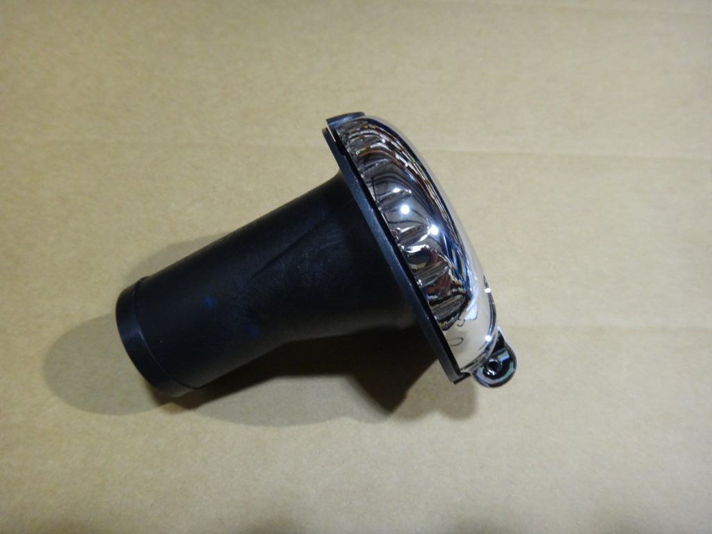 Fuel fill cap with black body and chrome top, designed for vehicle refueling.