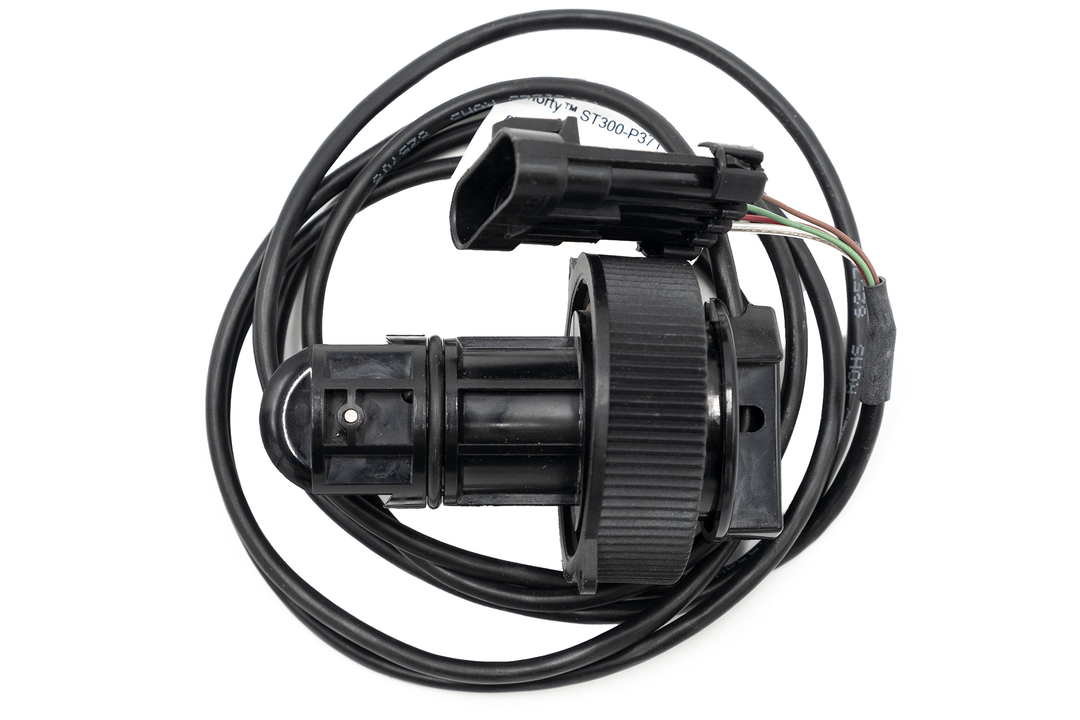 Airmar paddle wheel speed sensor with black housing, attached wiring, and adjustable mounting knob for marine speed measurement.