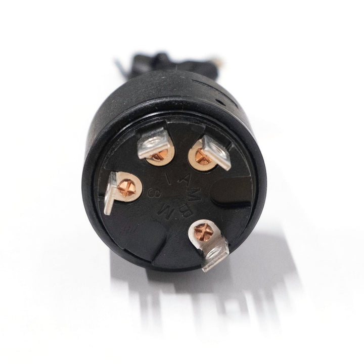 Ignition switch for Malibu vehicle, featuring multiple metal contact pins and a black plastic housing, used for starting the car.