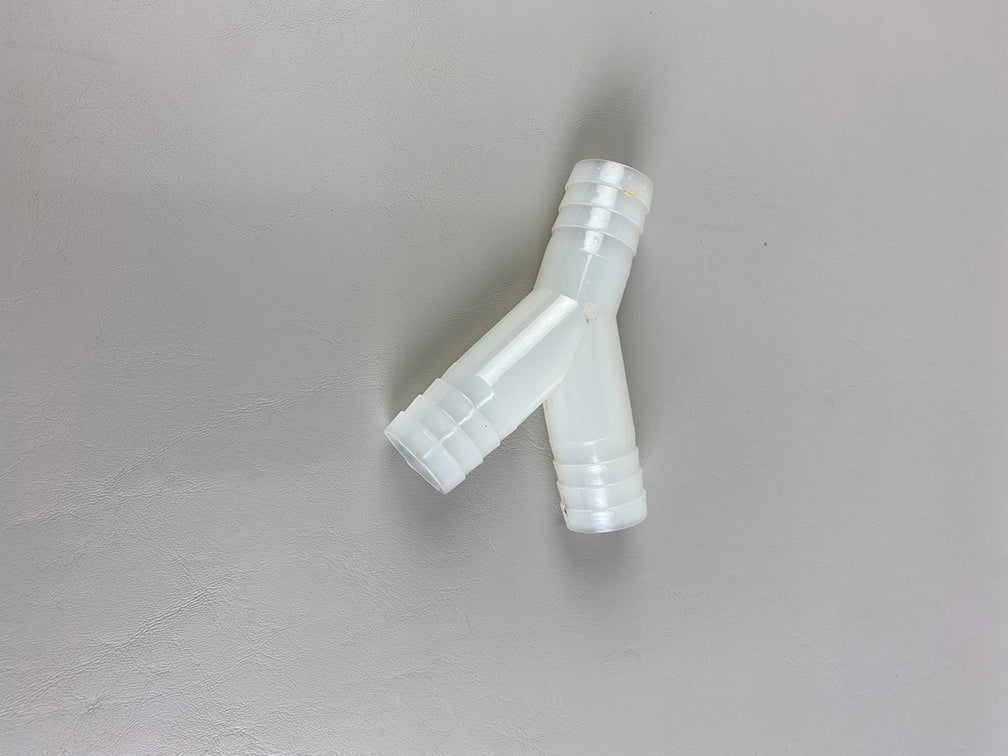 White nylon Y fitting barb for 1 1/8 inch hose, used in plumbing or fluid transfer applications.