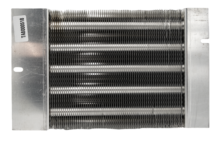 Alt text: "Close-up view of a Maradyne 2-outlet heater core featuring a dense arrangement of metallic fins and tubes with mounting flanges on each side, labeled with part number &