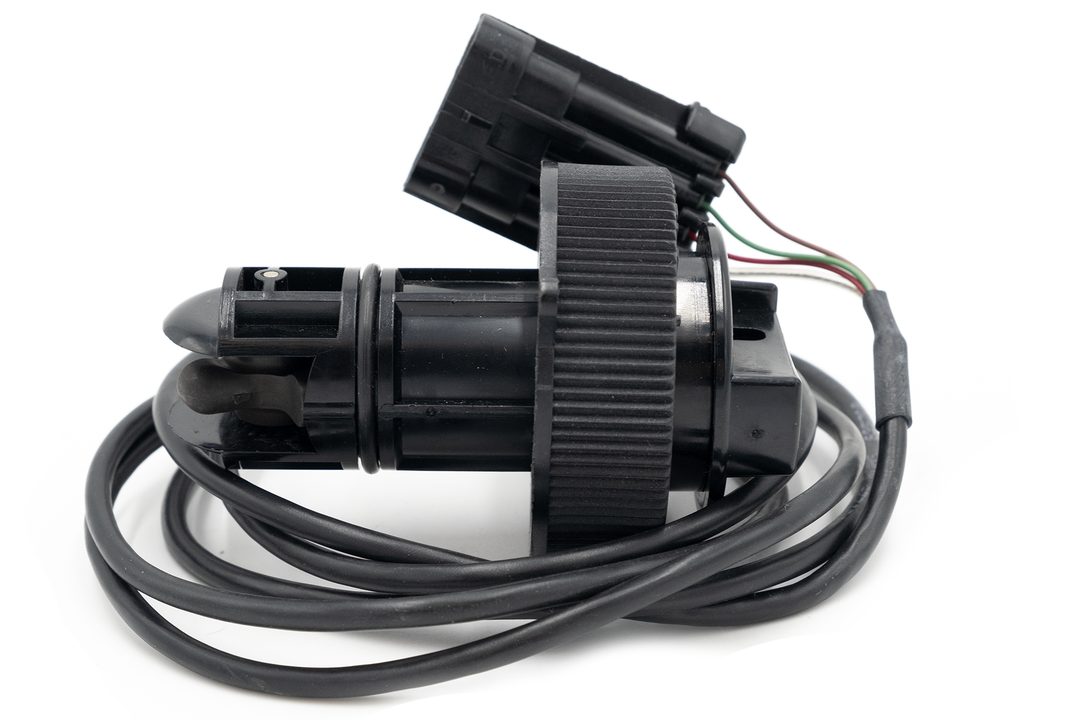 Airmar paddle wheel speed sensor with black housing, attached wiring, and a rotating paddle for boat speed measurement.