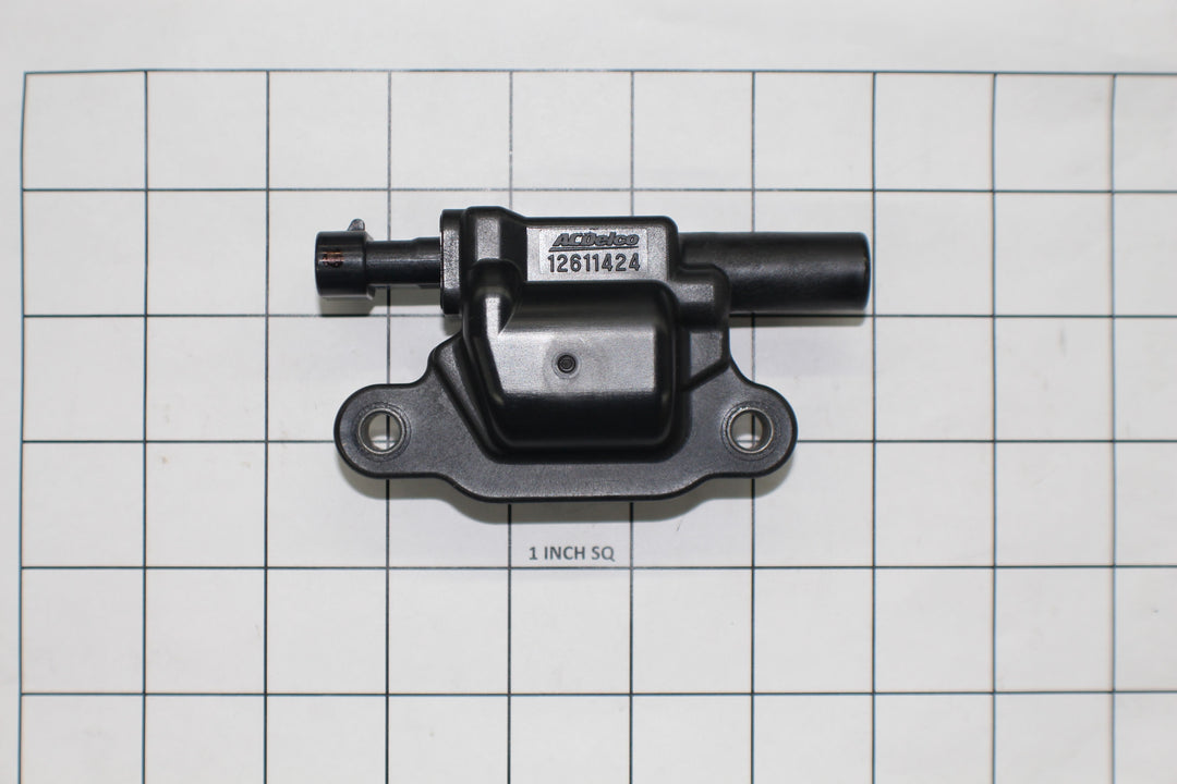 Coil ignition for L96, LS3, and LSA engines, black plastic and metal component with mounting holes and connector.