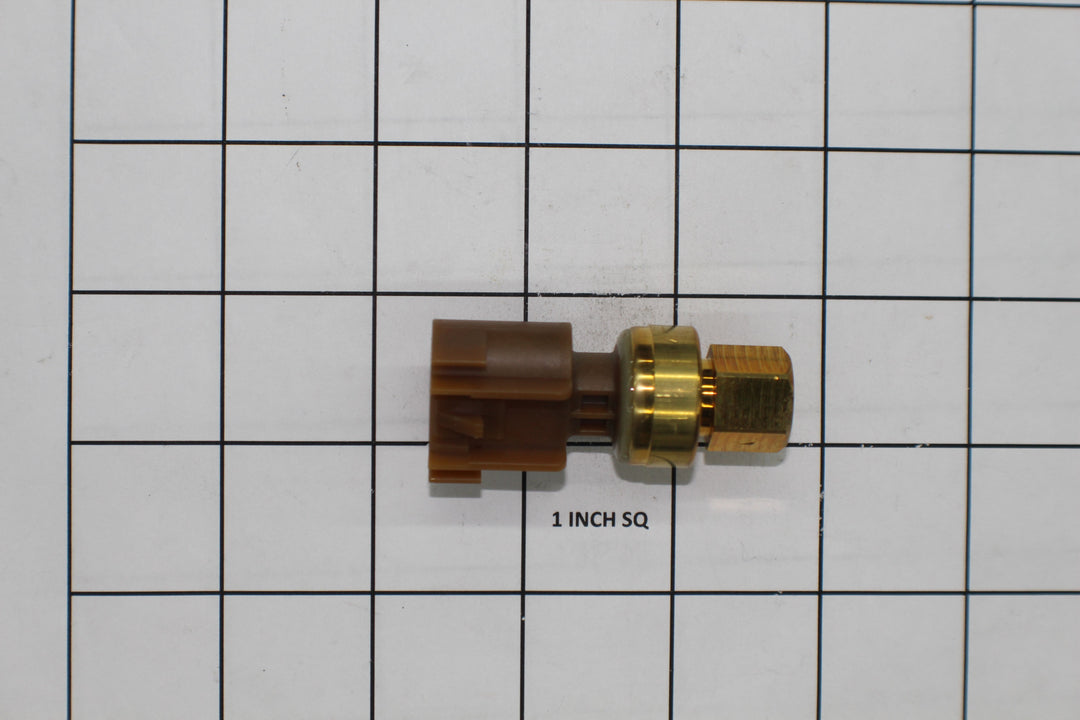 Fuel pressure sensor for GM models, with electrical connector and brass fitting, on a grid background.