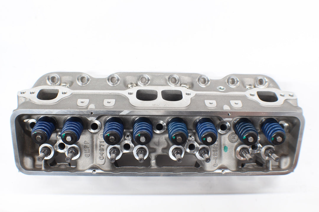 Head CYL Hammerhead engine cylinder head with valve springs and ports, used in automotive or motorcycle engines.