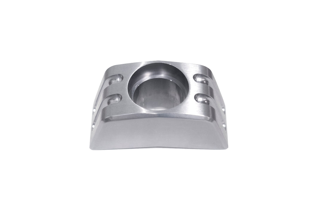 Aluminum back-up camera mount with a central hole for securing a camera, designed for vehicle rearview systems.