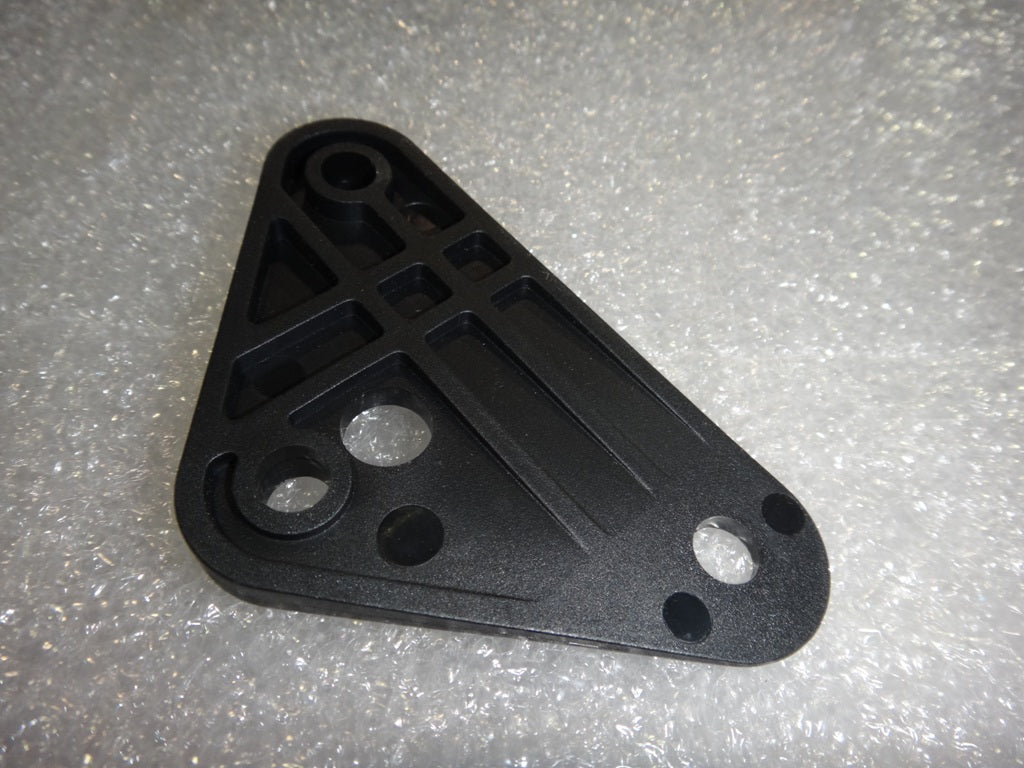 Black Surf Gate Bracket Shim with multiple mounting holes and structural support features, used for boat surf gate adjustments.