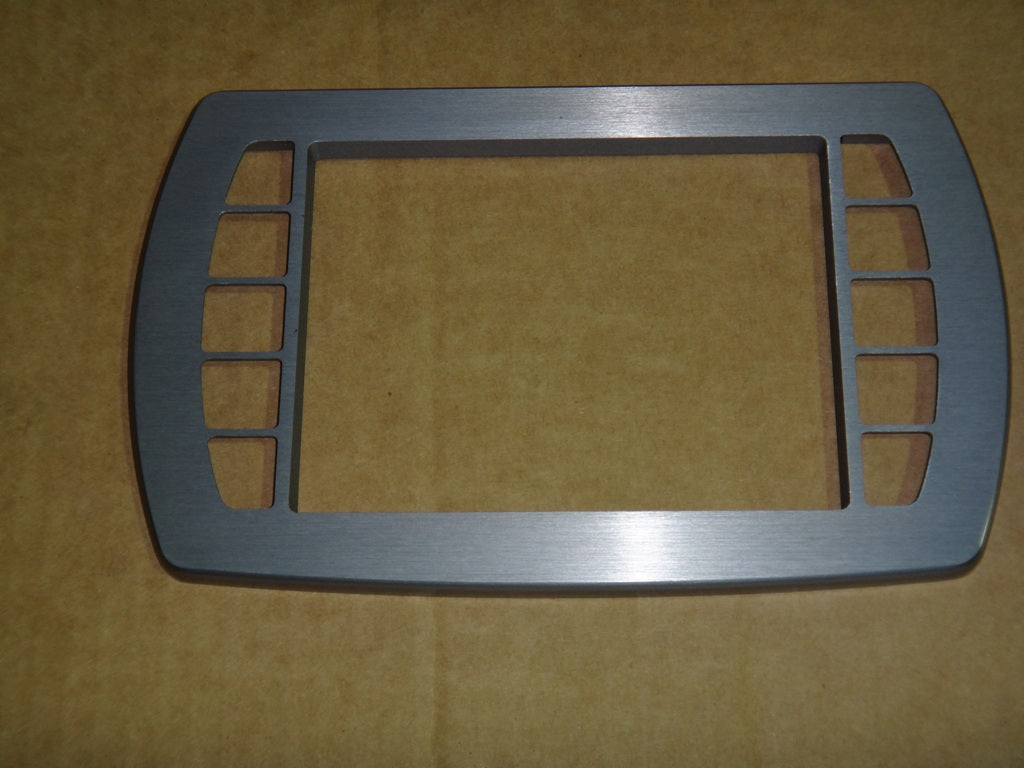 Bezel medallion display frame in brushed gray anodized aluminum with rectangular cutouts, designed for a 2013 model.