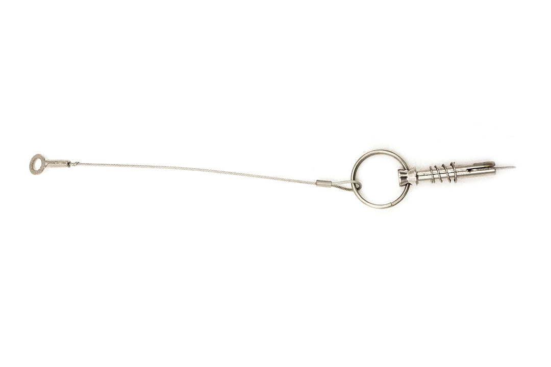 Pull pin with cable, spring, and small tab lock, designed for secure fastening and quick release applications.