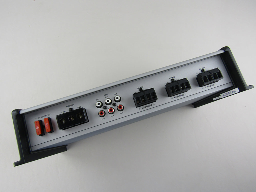 AXIS Wet Sounds Amplifier with multiple input ports, power switches, and circuit breakers for marine audio systems.