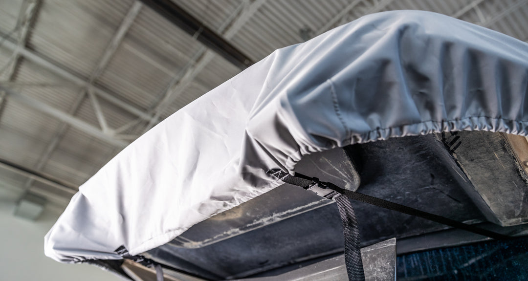 Swim platform cover for Axis boats (2013-2024), shown secured with straps over the boat&
