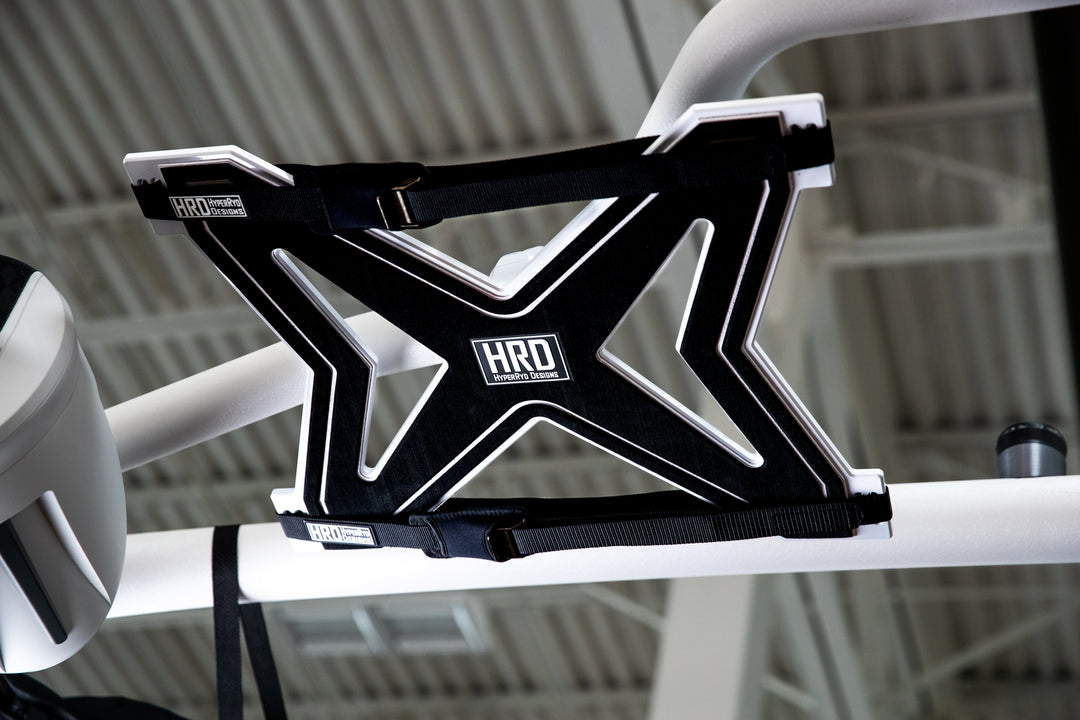 Black and white XR1 surf rack mounted on G3 and G5 towers, designed for carrying surfboards on a vehicle roof.