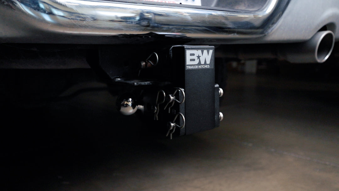 Black B&amp;W TOW &amp; STOW adjustable ball mount hitch attached to vehicle&