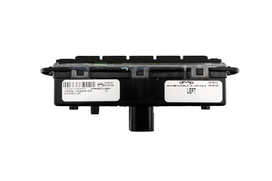 Left Mux Switch Module with black plastic casing, labels, and connector port, used for vehicle electronic control systems.