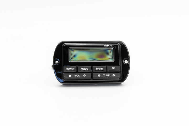 Black stereo transom remote control with digital display and buttons for power, mode, band, volume, and tuning.