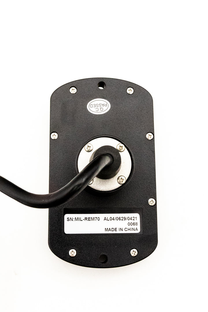 Back view of a stereo transom remote for Malibu/Axis boats, featuring a black mounting plate, screws, and a connected cable.