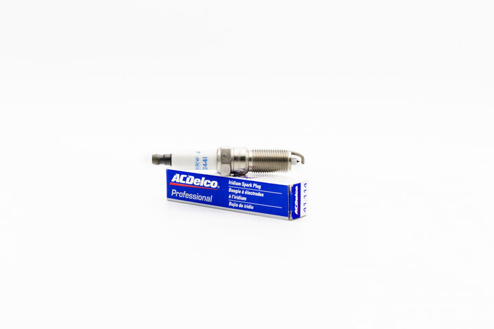 Malibu M-Series spark plug M5DI/M6DI resting on blue and white AC Delco box, designed for ignition in small engines.