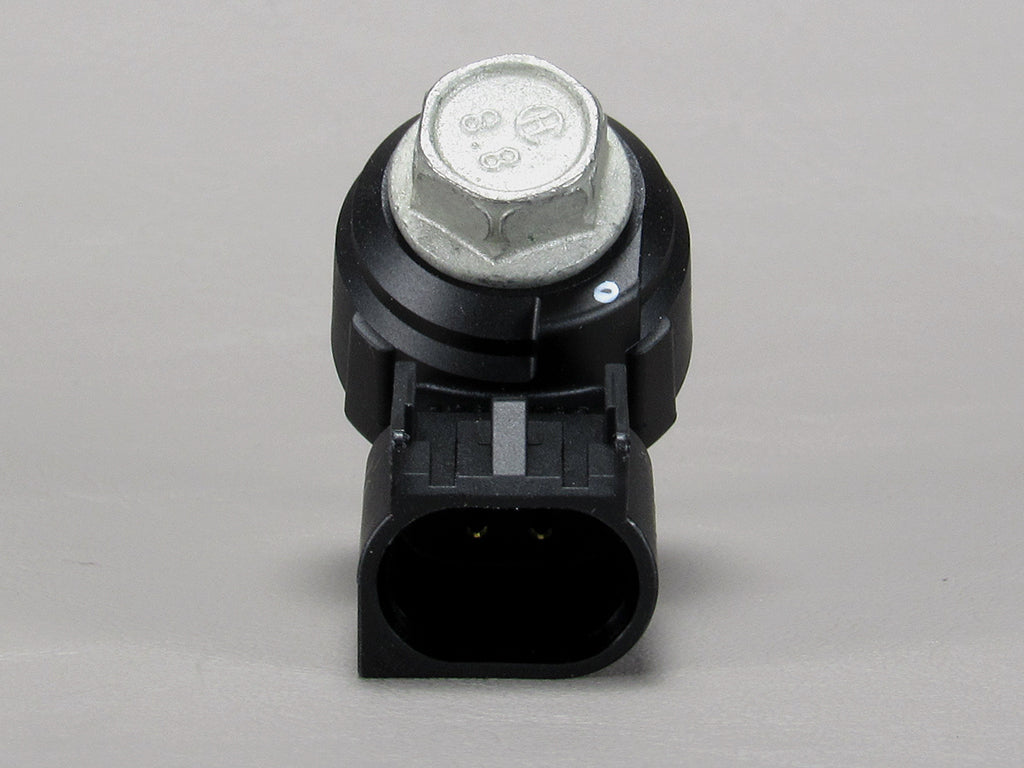 Malibu Monsoon M Series Knock Sensor with metal mounting bolt and black electrical connector, used for engine vibration detection.