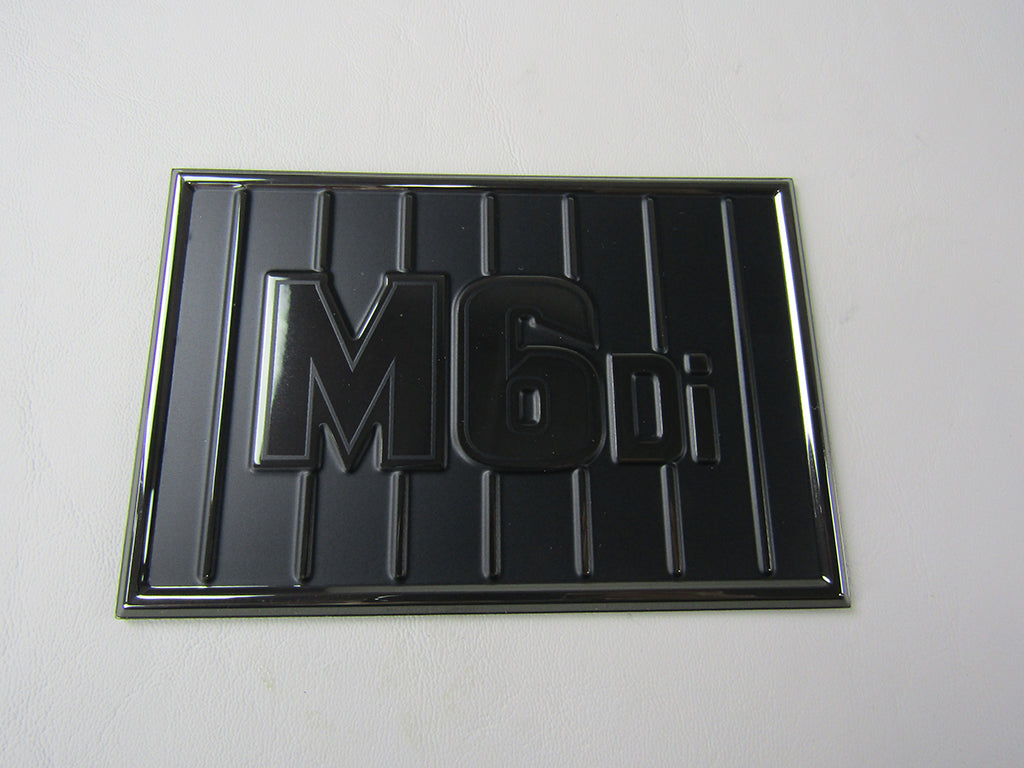 Decal M6DI Engine Cover in black chrome finish, designed for vehicle engine protection and customization.