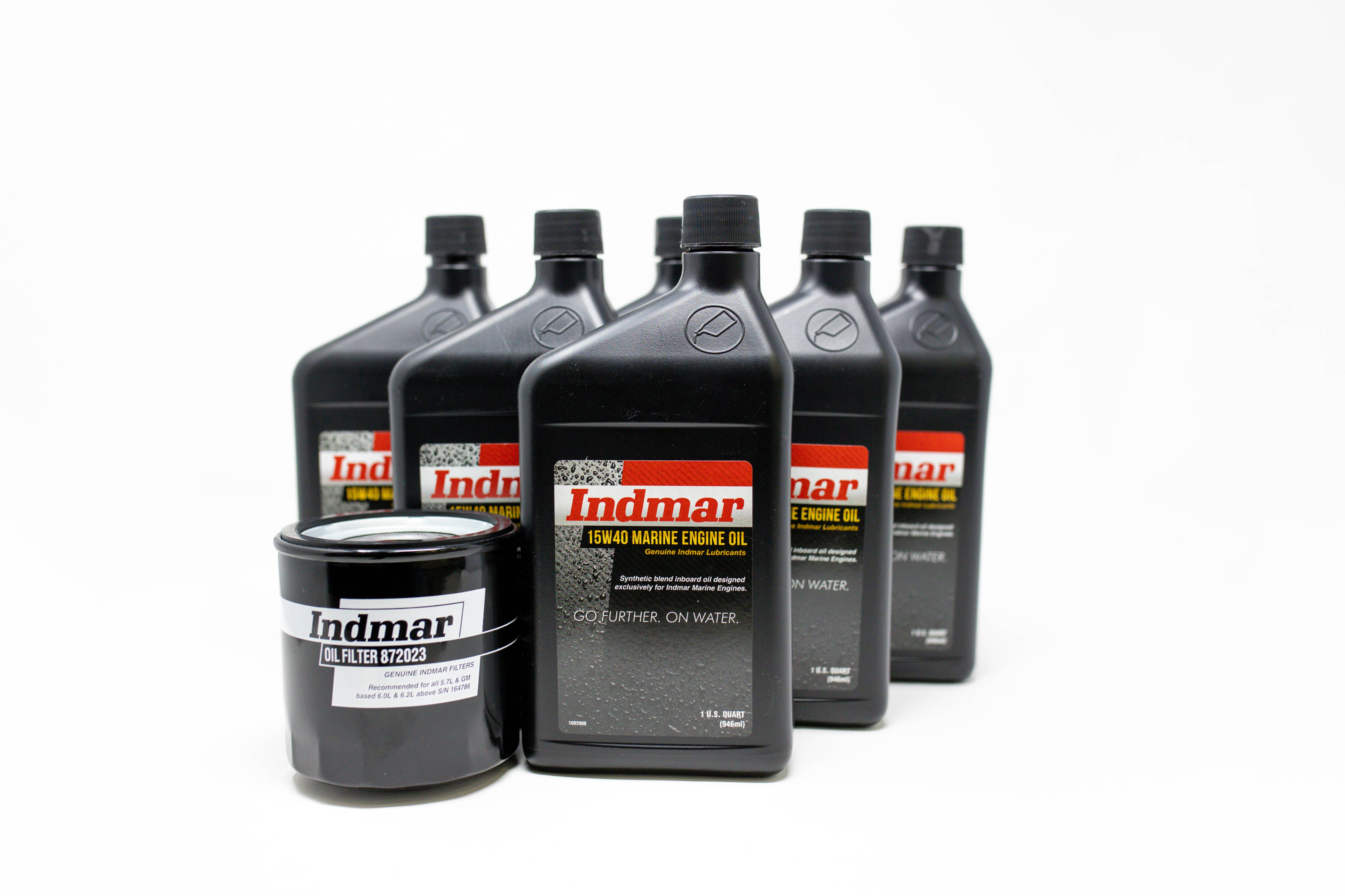 Set of five black bottles of Indmar Marine Engine Oil and a black oil filter with white label, used for boat engine maintenance.