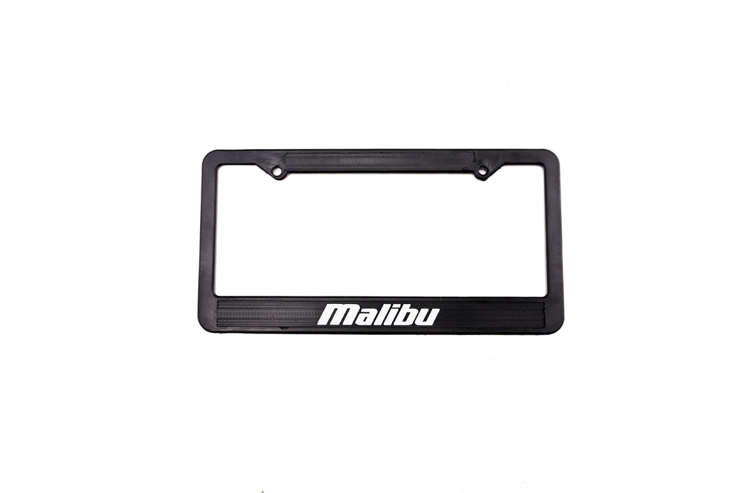 Black Malibu/Axis license plate frame with white "Malibu" logo at the bottom center.