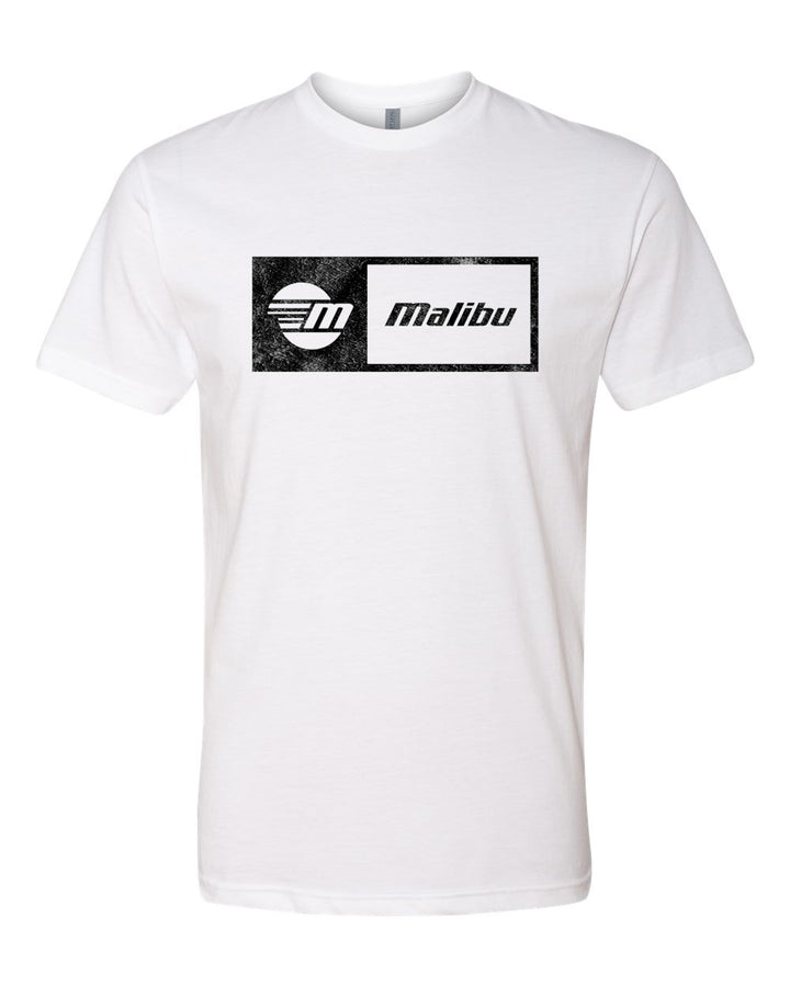 White Malibu Statement Tee with black graphic logo featuring a circular design and the word "Malibu" inside a rectangular frame.
