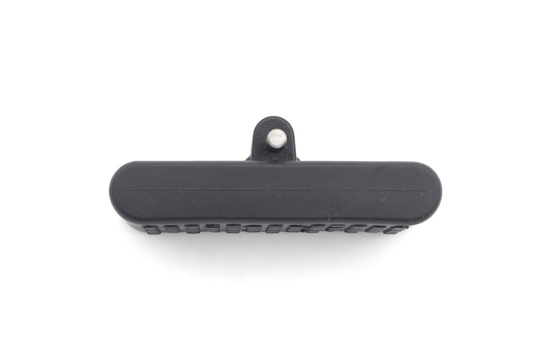 PTM Gen2 Clamp Wake Feet, black foot pedal with textured surface and metal attachment point, used for wakeboarding.