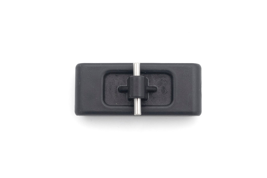 PTM Gen2 Clamp Wake Feet, black rectangular device with metal pin and adjustable clamp for securing equipment.