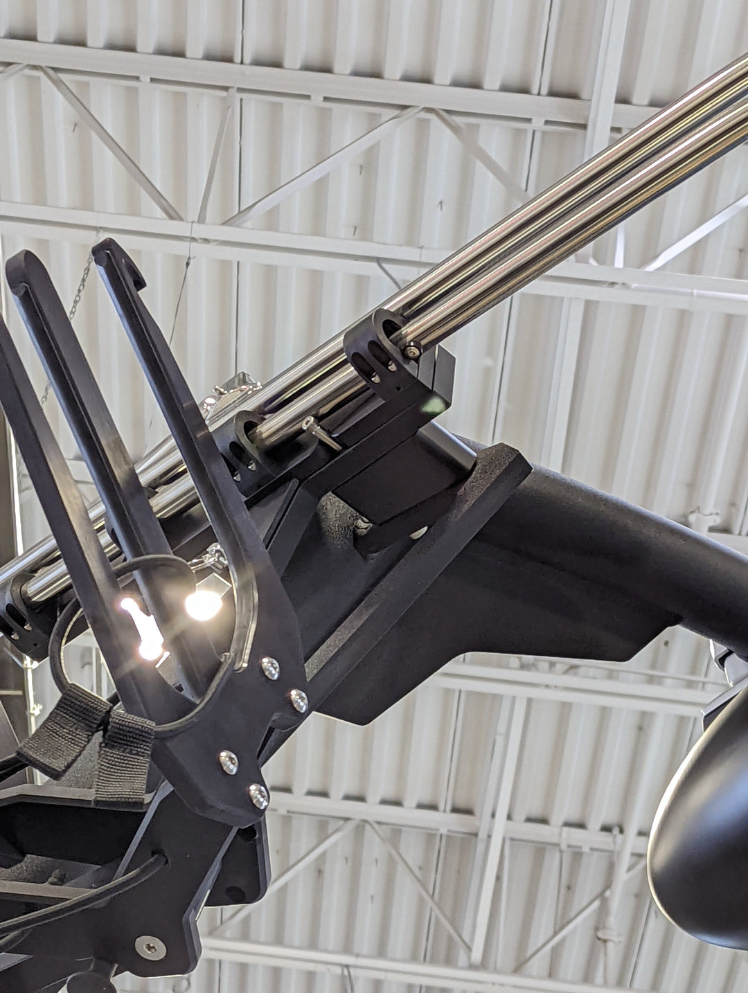 Close-up of the AXIS AW20 Slider Bimini complete, featuring stainless steel support poles and black mounting hardware.