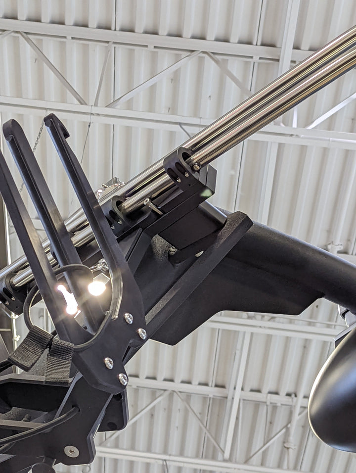 Close-up of the AXIS AW20 Slider Bimini complete, featuring stainless steel support poles and black mounting hardware.