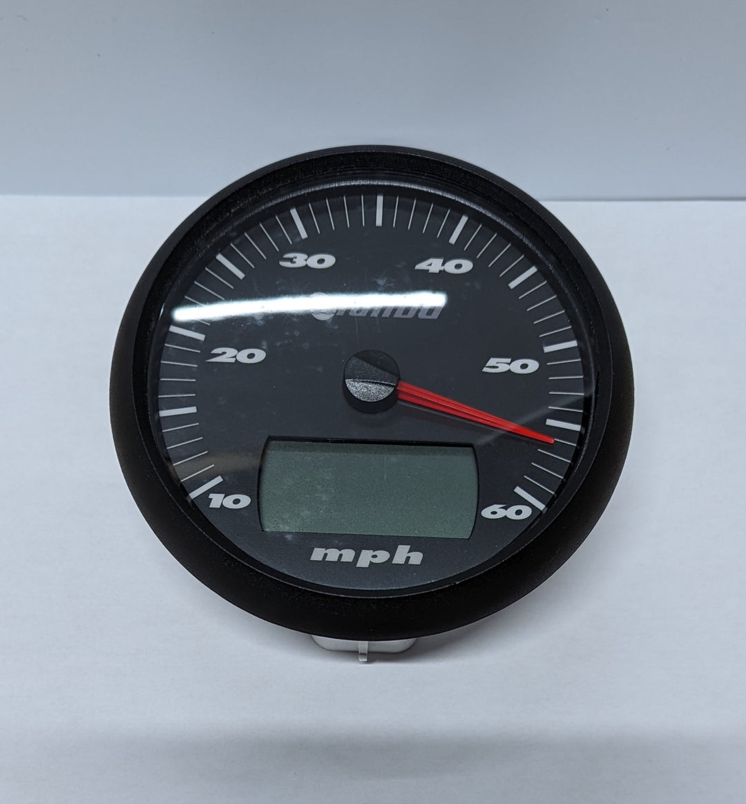 Speedometer with a 5-inch LCD display, black face, white markings, and a red needle pointing to 50 mph.