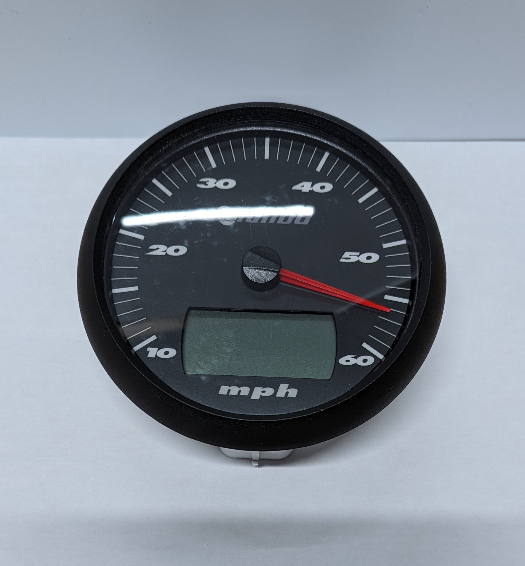 Speedometer with a 5-inch LCD display, black face, white markings, and a red needle pointing to 50 mph.