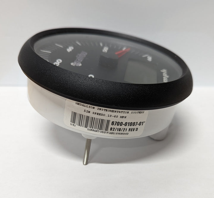 Speedometer with a 5-inch LCD display, black bezel, and white body, showing speed range 10-60 MPH.