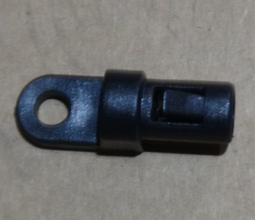 Plastic screw eye strap end for 1/4 inch poly cord, with a hole for mounting and a locking mechanism.