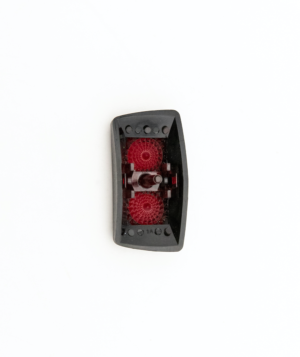 Black Nav/Anchor switch cover with red indicator lights, designed to fit over a boat&