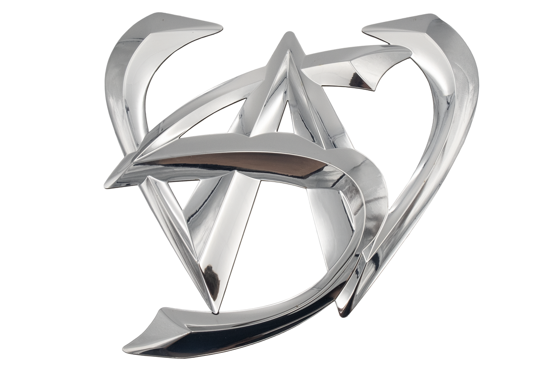Chrome overlay emblem featuring a stylized "WS" design with intersecting and sharp angular elements, showcasing a reflective metallic finish on a white background.