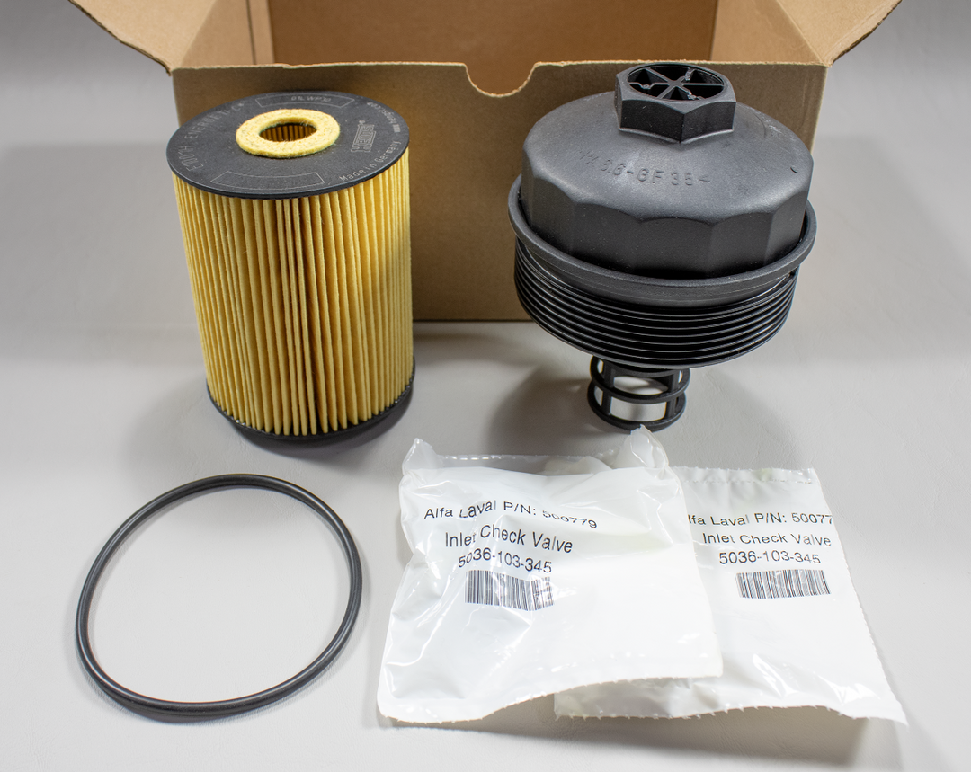 Oil filter cap service kit with filter, check valve, O-ring, and packaging for vehicle maintenance.