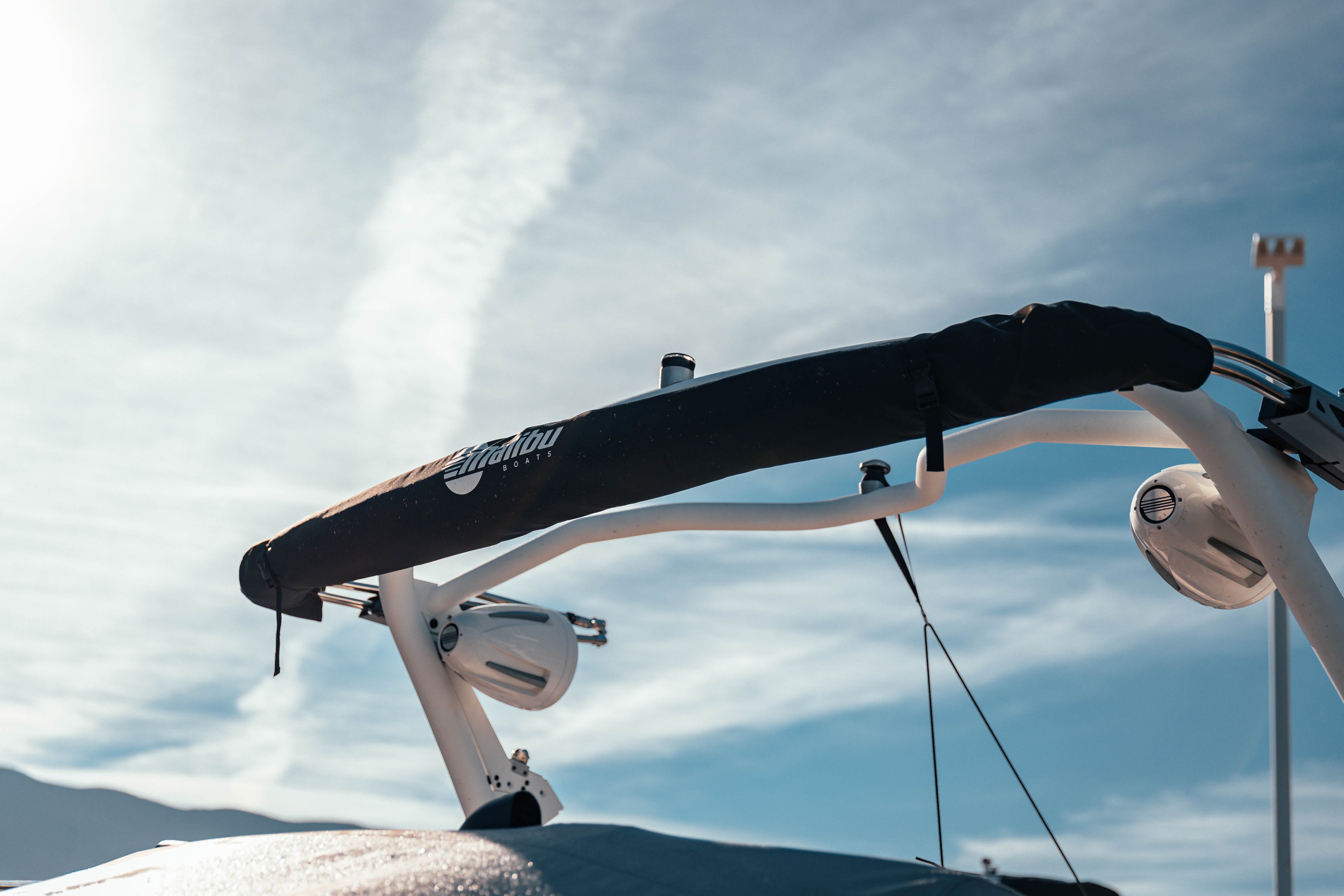 GV Complete Slider Bimini with Extension installed on a boat, providing shade with a black fabric cover and white frame.