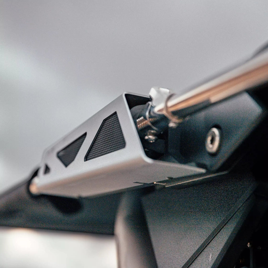 Close-up of the Malibu G10+ Bimini Hardware Kit mounted on a boat, showing metal brackets and mounting components.
