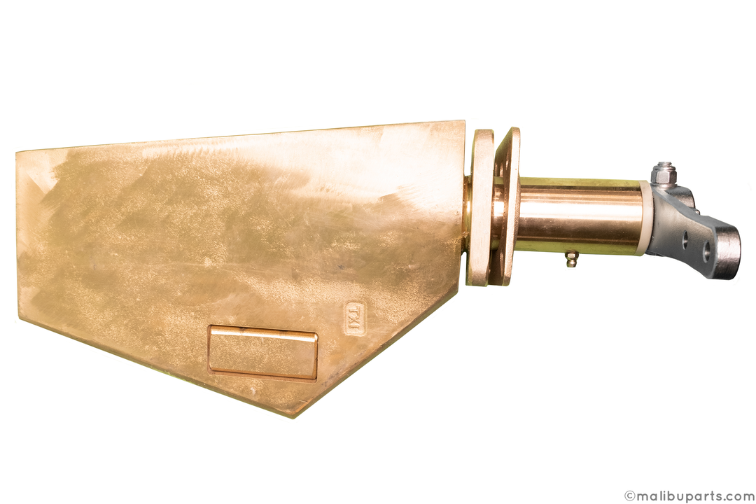 A metallic rudder with a gold-colored blade and a cylindrical attachment, used for steering in marine or aerospace applications.